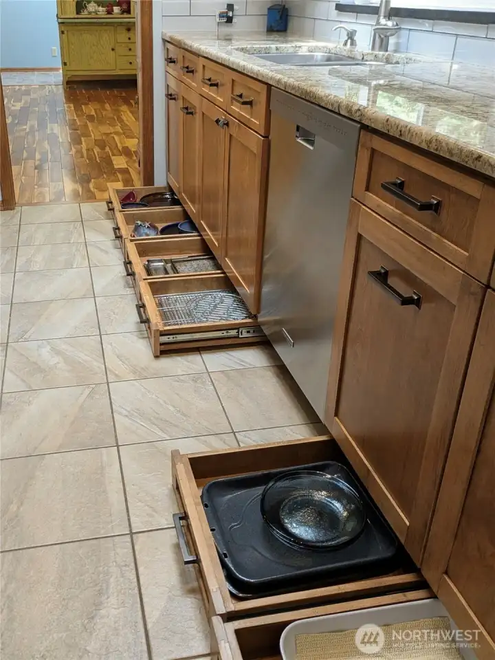 Custom solid wood cabinetry and extra "toe-kick" storage drawers!