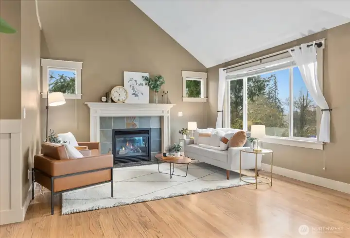 Vaulted ceiling living room featuring gas fire place.