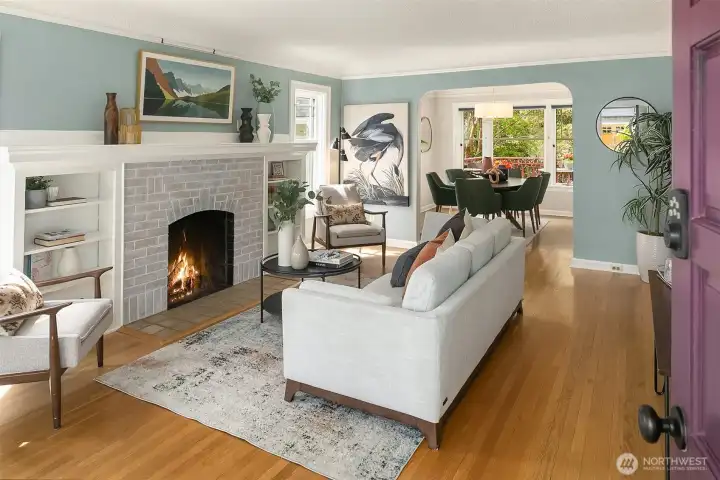 From the front door, enter the living room with cozy gas fireplace and warm hardwood floors.