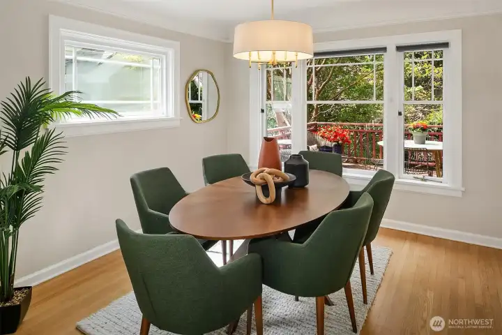 The formal dining room has a picture window looking out to the back deck.