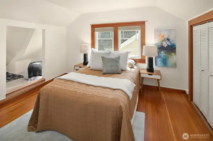 The second upstairs bedroom includes a charming nook.