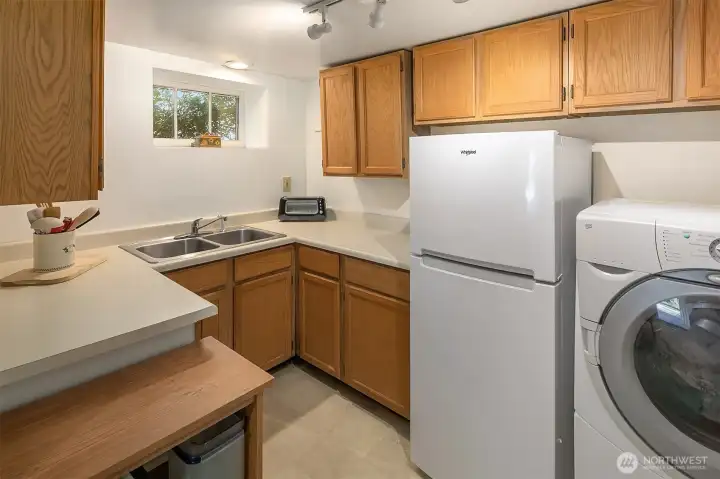 The kitchenette currently has a washer/dryer, but has an outlet for a stove if desired.