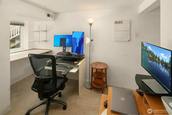 This extra basement room is currently being used as an office.