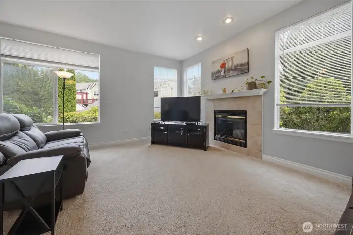Natural light and a cozy fireplace come together to make this space feel warm, bright, and impossible to leave. Natural light and a cozy fireplace come together to make this space feel warm, bright, and impossible to leave.