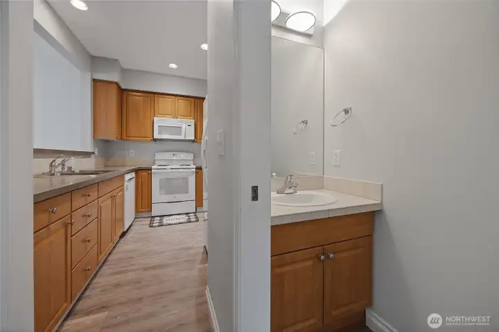 A well-positioned half bath right off the living area is perfect for guests and everyday convenience alike. A well-positioned half bath right off the living area is perfect for guests and everyday convenience alike.