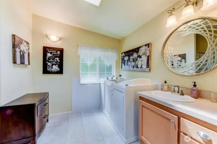 Primary en-suite with convenient walk-in tub. Primary en-suite with convenient walk-in tub.