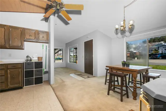 Ceiling fan to manage air/heat flow with wide open kitchen to dining area.