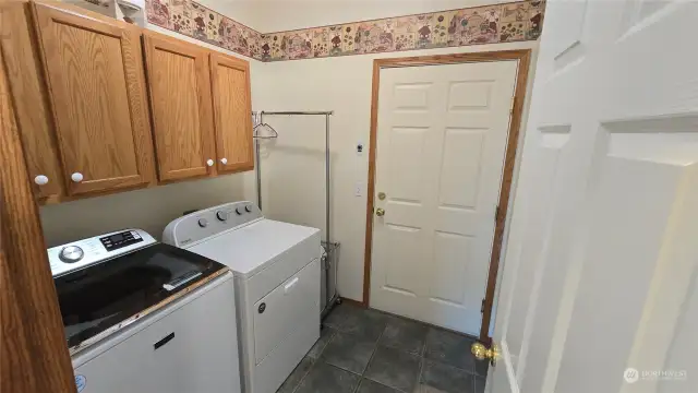 mudroom/laundry room with easy one level access to the garage