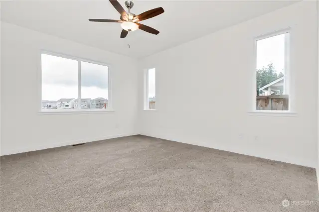 Primary bedroom includes ceiling fan. Photo for illustration only of similar home, not actual.