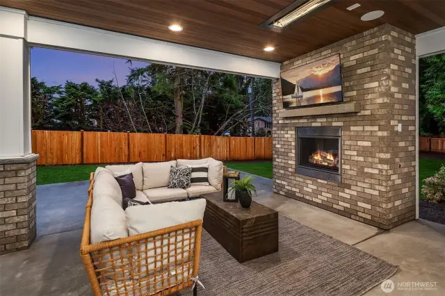 Outdoor covered living area with fireplace