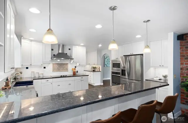 Beautiful white cabinets accent stainless appliances