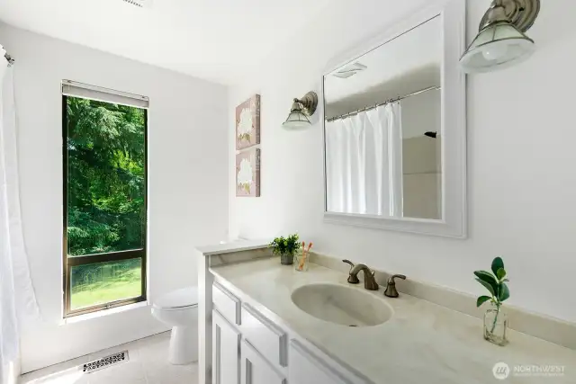 Full bathroom in hall.