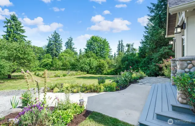 Front porch with with French doors to the Bonus room. Surrounded by beautiful new landscaping.