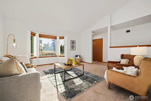 A perfect start to your day—sip coffee in the sun-drenched bay window while watching the neighborhood come to life. This spacious front living room offers comfort, charm, and room to gather.