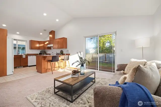 Let the light pour in—large windows and sliding glass doors open to the private backyard, blending indoor comfort with outdoor moments.