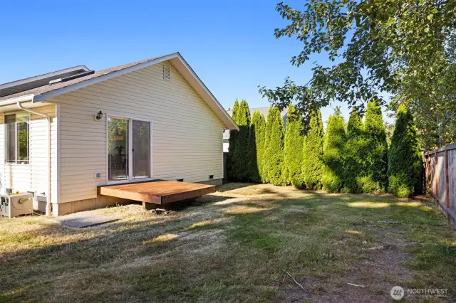 The small deck off the back patio is the perfect place for a BBQ or enjoying your favorite beverage.