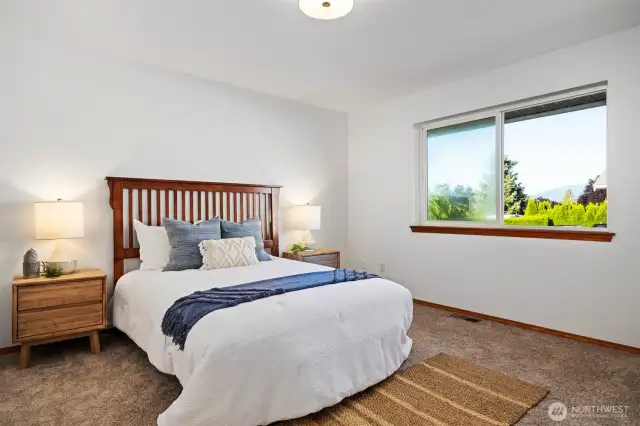 The primary bedroom is spacious and tucked back at the far end of the hallway.