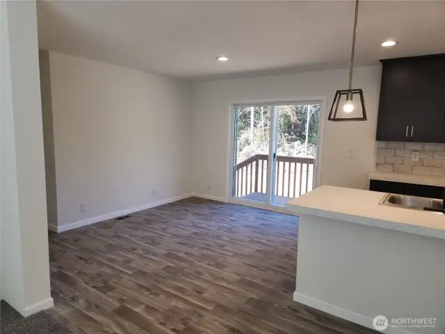 The dining area has a wonderful view of the back of the property and lots of space for a good sized table.