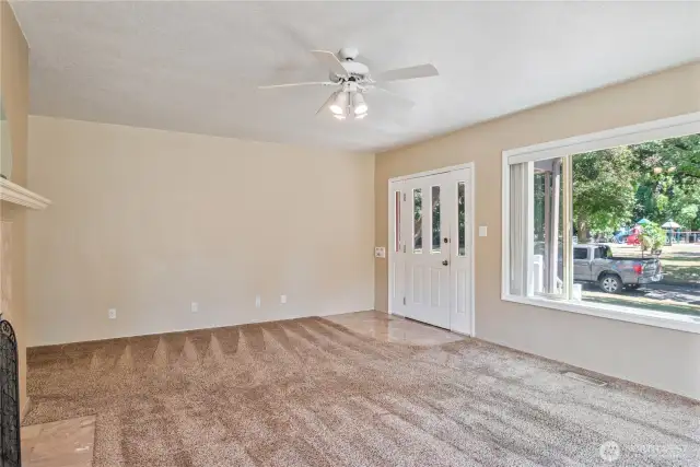 Spacious living room with tons of natural light overlooking Vandercook Park