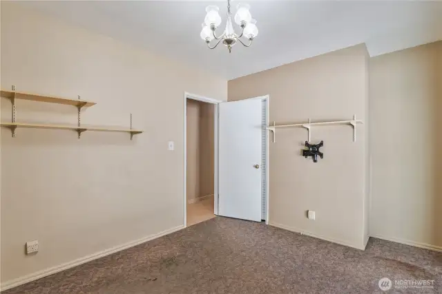 Second bedroom on main floor with second sliding glass door to the backyard