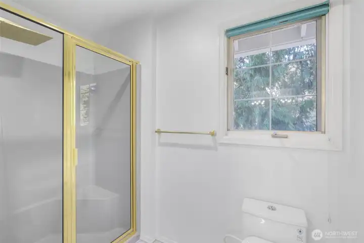 The primary suite also includes a separate shower and private water closet, designed to enhance convenience and privacy.
