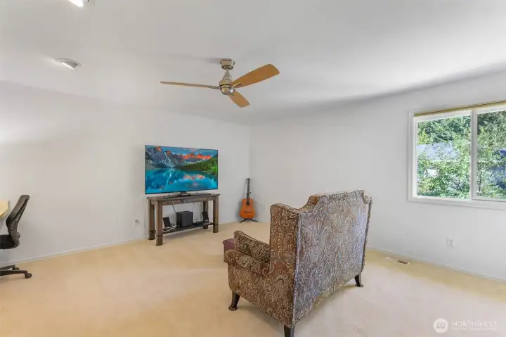 A versatile upstairs bonus room expands the living options, perfect for a media space, hobby room, or study area.