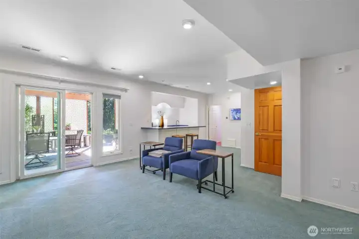 A wide-open view of the lower level highlights its seamless connection to the patio and backyard. With ample space for entertainment, this level extends the home’s functionality.