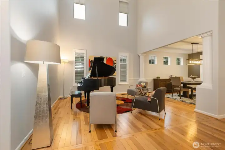 The living room and foyer feature vaulted ceilings and clerestory windows offering lots of natural light...