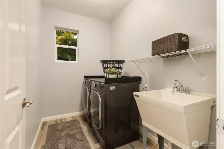 Upstairs laundry room! Washer and dryer are 4-years new!