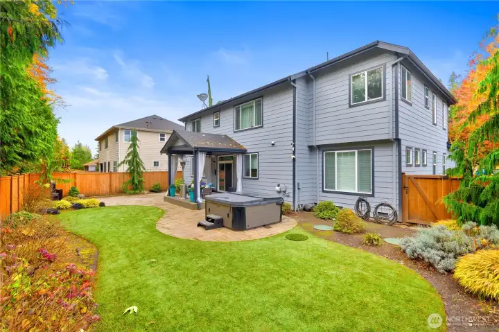 A sumptuous backyard - very easy to maintain yard featuring artificial turf that looks so real!