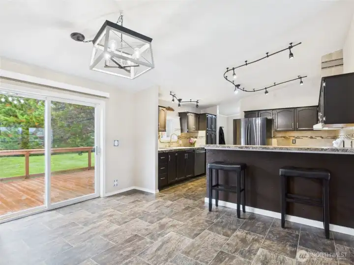 Open kitchen with eating counter.