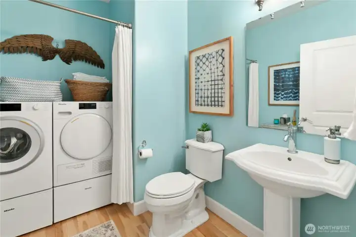 First laundry is in the powder room on the main floor.