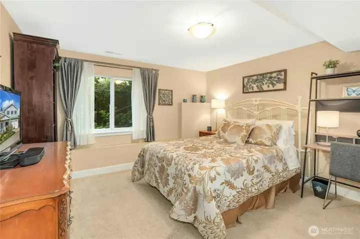 Bedroom #2 downstairs with closet.  Nice view to gardens.