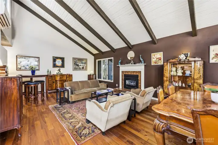 Large living room features a propane-fired fireplace for chilly nights and hardwood floors.