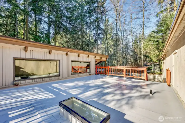 The flat roof was recently replaced with an impervious membrane. The door on the right is barely visible, but there is more storage space in there.