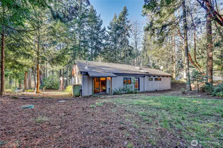 Looking from the back corner of the property at the back of the house. You can see the septic tank risers here.