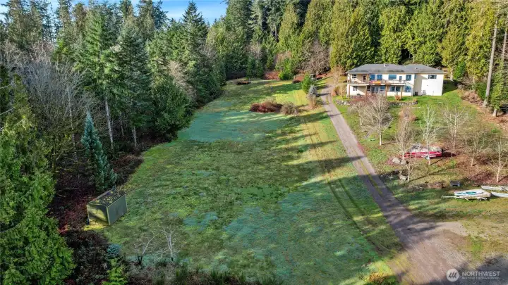 Lot gently slopes down to the see, perfect for daylight basement...