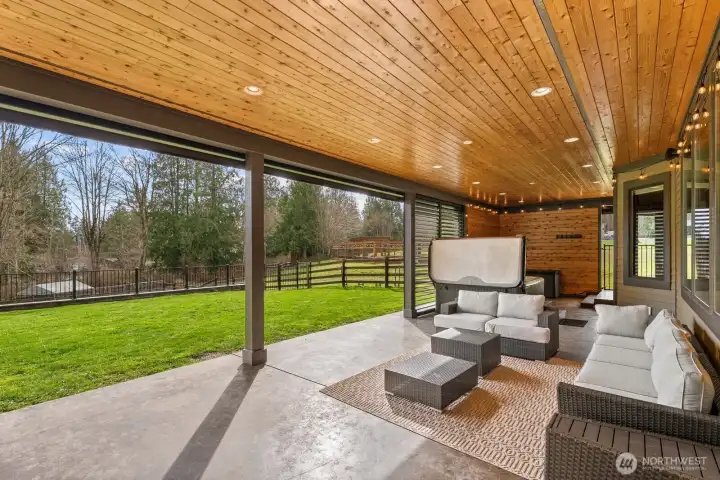 Private outdoor living space with remote controlled shades.