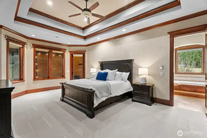 Primary bedroom with door out to outdoor bathroom and private hot tub.