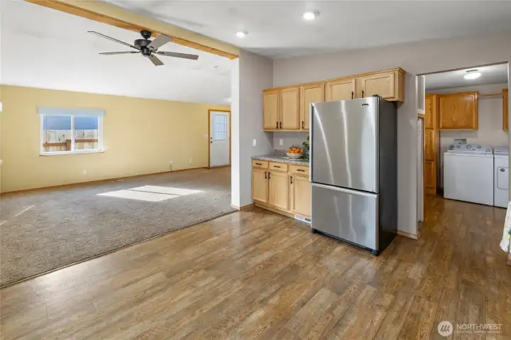 Large SS fridge is included, easy access to the oversized laundry room and to the side deck.