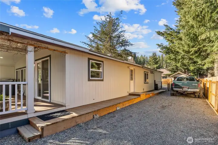 Side porch built just for the RV space - easy access to the house. 40' gated area for the RV and other vehicles (great off street parking!)  50 amp service too!