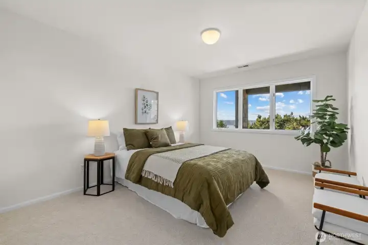 Bedroom 2 on the main level (staged)