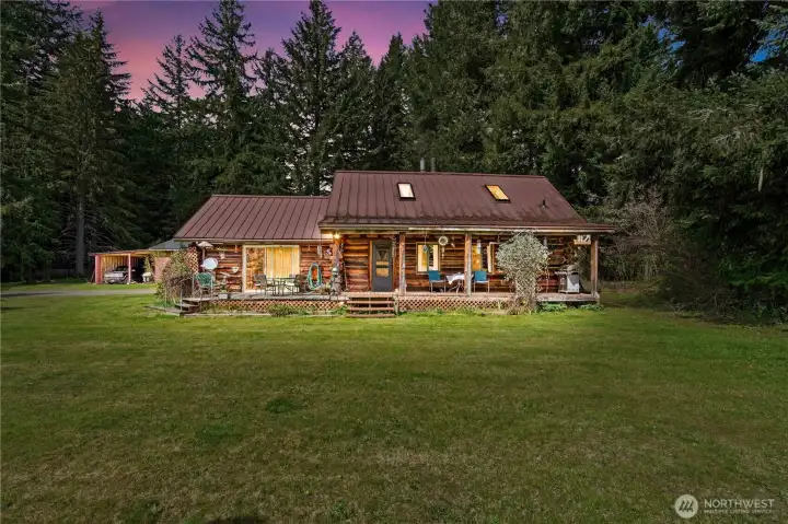 Another Covered Porch on the Front side along with an uncovered deck area off of the Family Room.