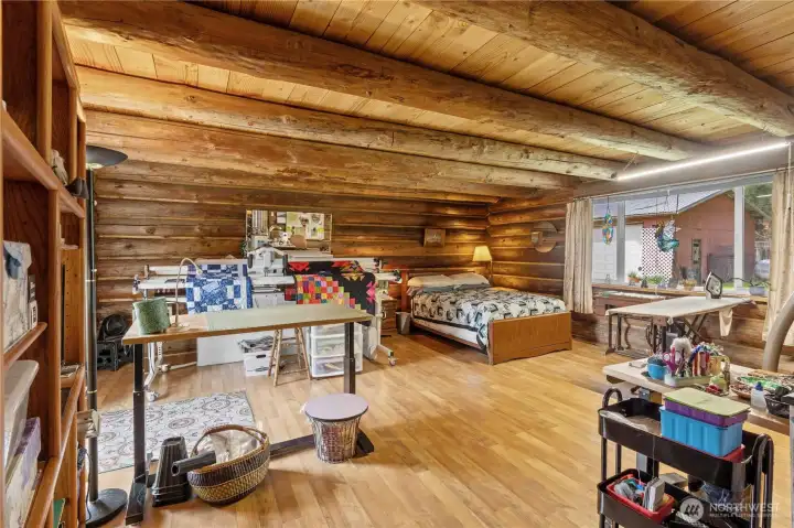 Family Room w/Laminate Flooring and Newer Vinyl Windows and Slider. Currently used as a guest room and quilting room, this space offers a ton of options!