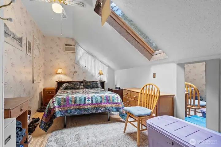 Bedroom #1 w/Vaulted Ceilings, Ceiling Fan & Skylight.