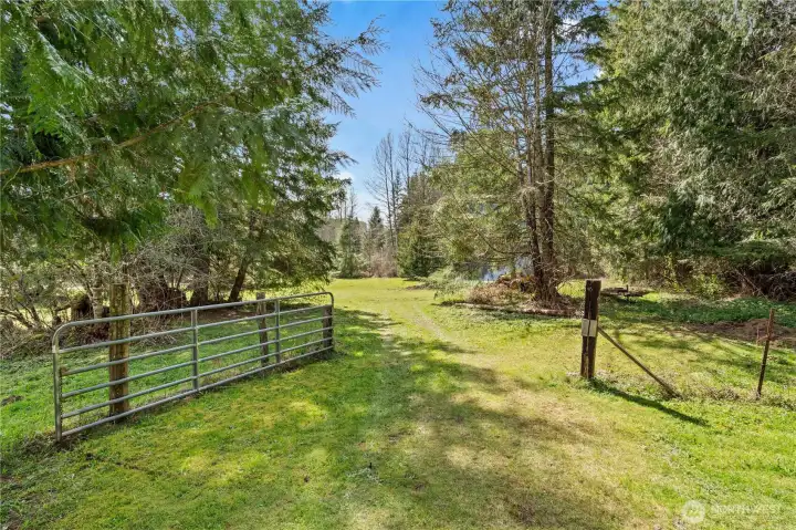 Opening this wide gate leads to another pasture. You can drive through this gate easily.