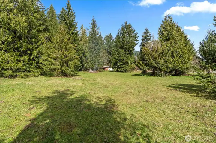 From the far corner by the road, looking back toward the home.