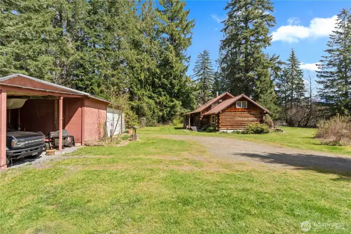 There's plenty of room to house your cars, lawn equipment, tractor, etc in this Garage/Shop.