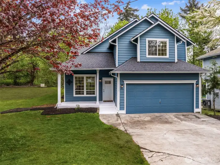 Step onto the welcoming front porch that sets the tone for this warm and inviting home. Surrounded by nature, it offers the perfect spot to enjoy quiet mornings or peaceful evenings. The freshly painted exterior and new roof create a crisp, modern look while ensuring long-term peace of mind. This home blends timeless style with thoughtful updates.
