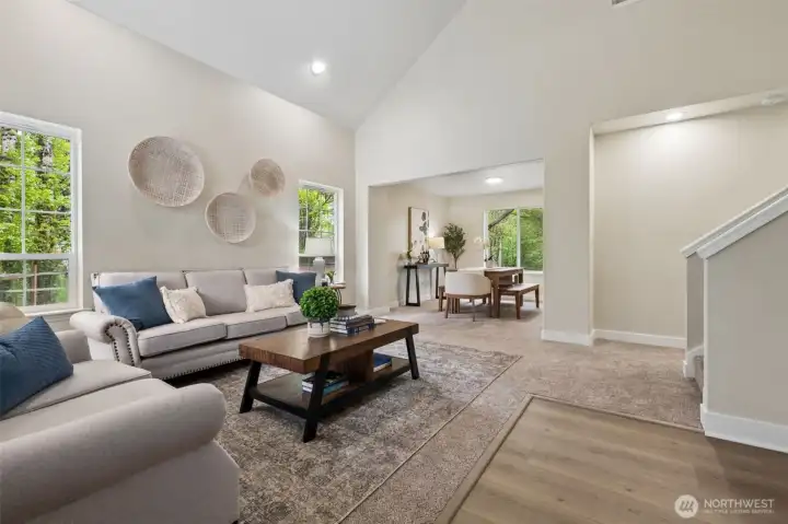 The entryway greets you with natural light and fresh interior paint, creating an immediate sense of warmth. New flooring throughout adds a clean, modern touch that carries throughout the home.